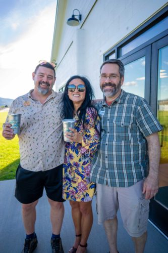 Draught Works co-owner Paul Marshall poses with past employee Nicole Toone and Glenn Marangelo