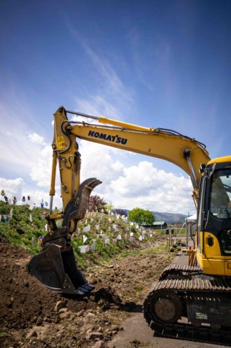 A front loader truck waiting to break ground for the Rocky Mountain Exploration Center at the Missoula Fairgrounds.
